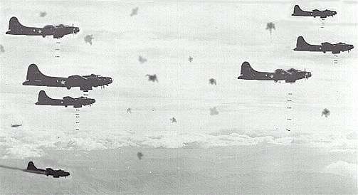 B-17's dropping their bombs over Germany amidst puffs of flak