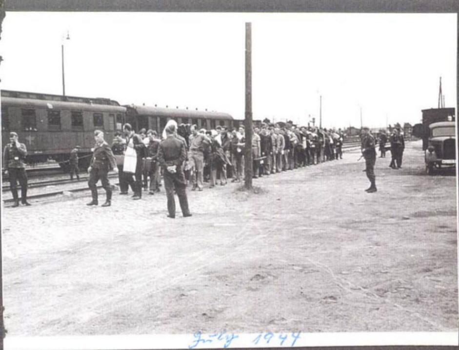 Prisoners of War at train station,  awaiting march to Stalag Luft I camp
