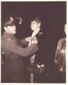Presentation of Lt. Roper's air medal to his mother in his absence